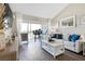 Bright living room features a large sliding door providing access to a beautiful view at 408 Cerromar S Cir # 331, Venice, FL 34293
