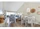 Bright living room and dining area boasts contemporary decor, vaulted ceilings, and stylish accents at 408 Cerromar S Cir # 331, Venice, FL 34293