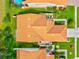 Overhead view of home and property, showcasing roof, patio, lawn, and nearby landscaping at 4114 Murfield E Dr, Bradenton, FL 34203