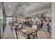 The bar area has multiple TVs, seating, and floor to ceiling windows that allows for much natural light at 4114 Murfield E Dr, Bradenton, FL 34203