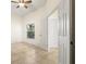 Well-lit bedroom with tile floors and multiple doorways at 4114 Murfield E Dr, Bradenton, FL 34203