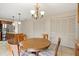 Open breakfast area next to kitchen, features a wooden table and tiled floors at 4114 Murfield E Dr, Bradenton, FL 34203