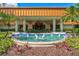 The building's entrance shows tropical landscaping with a beautiful fountain and mature palm trees at 4114 Murfield E Dr, Bradenton, FL 34203