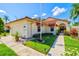 Well-maintained single-Gathering home with lush landscaping and an inviting front entrance at 4114 Murfield E Dr, Bradenton, FL 34203