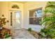 Charming front porch with decorative plants offering a warm and inviting entrance at 4114 Murfield E Dr, Bradenton, FL 34203