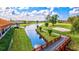 Beautiful view of the golf course, walking bridge, and water, showcasing the community's scenic landscaping at 4114 Murfield E Dr, Bradenton, FL 34203