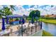 Scenic outdoor bar with serene water views, tables and umbrellas and community seating at 4114 Murfield E Dr, Bradenton, FL 34203