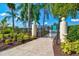 Inviting pool entrance with lush landscaping and clear signage, perfect for a relaxing community swim at 4114 Murfield E Dr, Bradenton, FL 34203