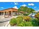 Golf course pro shop showcasing well-maintained landscaping, golf cart parking, and bag drop area at 4114 Murfield E Dr, Bradenton, FL 34203