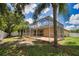 A lush backyard features a screened-in pool and patio area, offering privacy and a great outdoor space at 4150 Otoole St, North Port, FL 34291