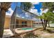 Enjoy the Florida lifestyle in this backyard with a screened pool, patio, and lush landscaping for a relaxing retreat at 4150 Otoole St, North Port, FL 34291
