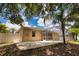 A concrete patio leads to a screened-in pool area in this backyard, perfect for entertaining and relaxation at 4150 Otoole St, North Port, FL 34291