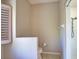 Neutral bathroom featuring a half wall next to toilet, a walk-in shower, and a shuttered window at 4150 Otoole St, North Port, FL 34291