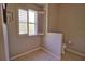 Cozy half-bathroom featuring tiled floors, neutral paint, and a shuttered window providing natural light and privacy at 4150 Otoole St, North Port, FL 34291