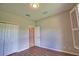 Bedroom features wood-look floors, neutral paint, double closet, and modern lighting at 4150 Otoole St, North Port, FL 34291