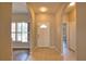 Inviting entryway with tile floors and arched doorways, showcasing the home's open layout and natural light at 4150 Otoole St, North Port, FL 34291