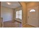 Bright living room features wood-look flooring and large shuttered windows that let in natural light at 4150 Otoole St, North Port, FL 34291