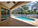 Relaxing screened-in pool with an extended deck, perfect for outdoor lounging and entertaining in a private oasis at 4150 Otoole St, North Port, FL 34291