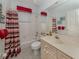 Comfortable bathroom featuring a tub with shower and a light color vanity at 4831 Summertree Rd, Venice, FL 34293