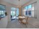 Cozy dining area with natural light and water views, furnished with a table and chairs at 4831 Summertree Rd, Venice, FL 34293