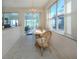 Cozy dining area with natural light and water views, furnished with a table and chairs at 4831 Summertree Rd, Venice, FL 34293