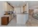 Bright kitchen features granite countertops, neutral cabinets, and modern appliances at 4831 Summertree Rd, Venice, FL 34293