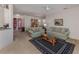 Inviting living room featuring neutral carpet, comfortable sofas, and a stylish coffee table at 4831 Summertree Rd, Venice, FL 34293