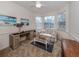 Comfortable living room with natural light, neutral walls, and a ceiling fan at 4831 Summertree Rd, Venice, FL 34293