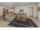 Cozy living room featuring neutral carpet, comfortable sofas, and a stylish coffee table at 4831 Summertree Rd, Venice, FL 34293