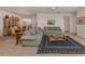Cozy living room featuring neutral carpet, comfortable sofas, and a stylish coffee table at 4831 Summertree Rd, Venice, FL 34293