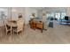 Bright living area featuring carpet, a chandelier, with comfortable furnishings near sliding glass doors at 4831 Summertree Rd, Venice, FL 34293