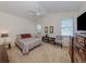 This main bedroom features neutral walls, carpet, a ceiling fan, and two windows for great natural lighting at 4831 Summertree Rd, Venice, FL 34293