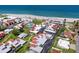 Aerial view of a beachfront community with a pool, tennis court, and easy access to beach at 500 Park S Blvd # 33, Venice, FL 34285