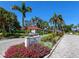 Community entrance sign welcomes residents with lush landscaping and mature trees at 500 Park S Blvd # 33, Venice, FL 34285