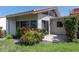 Charming home features a patio, mature landscaping, and a terra cotta roof at 500 Park S Blvd # 33, Venice, FL 34285