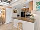 Well-equipped kitchen with a breakfast bar, modern appliances, and an open design at 500 Park S Blvd # 33, Venice, FL 34285