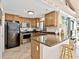 Stylish kitchen with granite countertops, modern appliances, and plenty of natural light at 500 Park S Blvd # 33, Venice, FL 34285