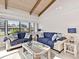 Inviting living room with comfortable sofas, stylish decor, and natural light from large windows at 500 Park S Blvd # 33, Venice, FL 34285