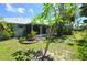 Lush backyard featuring vibrant greenery and a view of the home's exterior at 505 Duke Rd, Venice, FL 34293