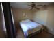 Comfortable bedroom with ceiling fan, neutral wall color, and closet, creates a peaceful retreat at 505 Duke Rd, Venice, FL 34293