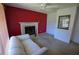 Cozy living room features a classic fireplace with tile surround and a comfortable striped couch for relaxation at 505 Duke Rd, Venice, FL 34293