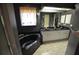 Luxurious main bathroom with black soaking tub, double sinks, granite countertops, and a modern vanity at 505 Duke Rd, Venice, FL 34293
