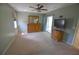 Serene main bedroom features carpet floors, a dresser with mirror, and sliding glass door leading to outdoor patio at 505 Duke Rd, Venice, FL 34293
