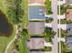 Aerial shot showcases the house and backyard, the location near the water and surrounding neighborhood at 511 Wexford Dr, Venice, FL 34293