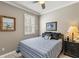 Cozy bedroom with a comfortable bed, neutral decor, and a window with natural light at 511 Wexford Dr, Venice, FL 34293