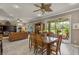 Spacious living room and dining room with lovely views of lush backyard and patio at 511 Wexford Dr, Venice, FL 34293