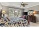 Bright main bedroom with large windows, plantation shutters, and a view of the outdoors at 511 Wexford Dr, Venice, FL 34293