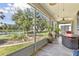 Relaxing screened patio with lake views and lush landscaping at 511 Wexford Dr, Venice, FL 34293