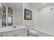 Clean bathroom featuring white fixtures, a tub/shower combo, and ample lighting at 5134 Northridge Rd # 303, Sarasota, FL 34238