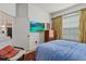 Comfortable bedroom featuring a window, TV, and access to other rooms at 5134 Northridge Rd # 303, Sarasota, FL 34238